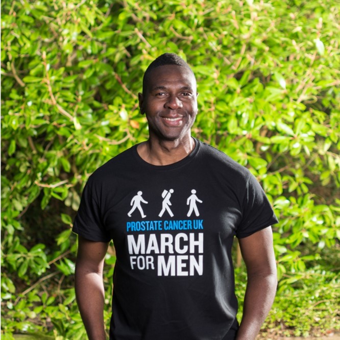 Man standing and smiling Man standing and smiling